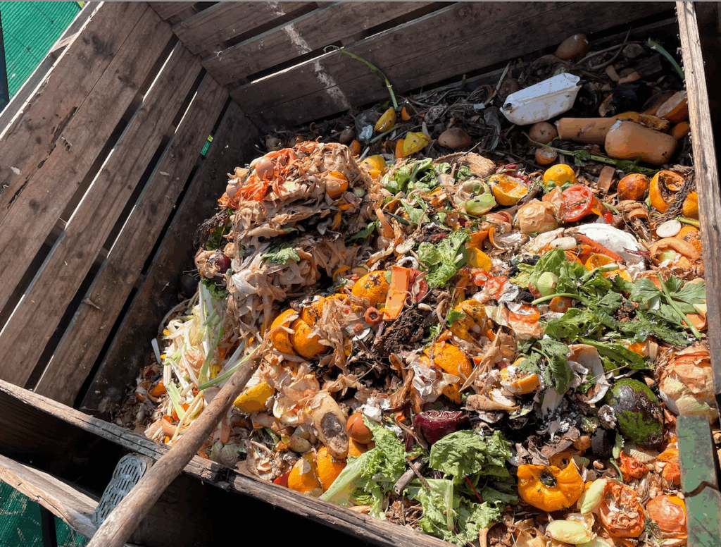 Food waste and compostable packaging in the compost pile